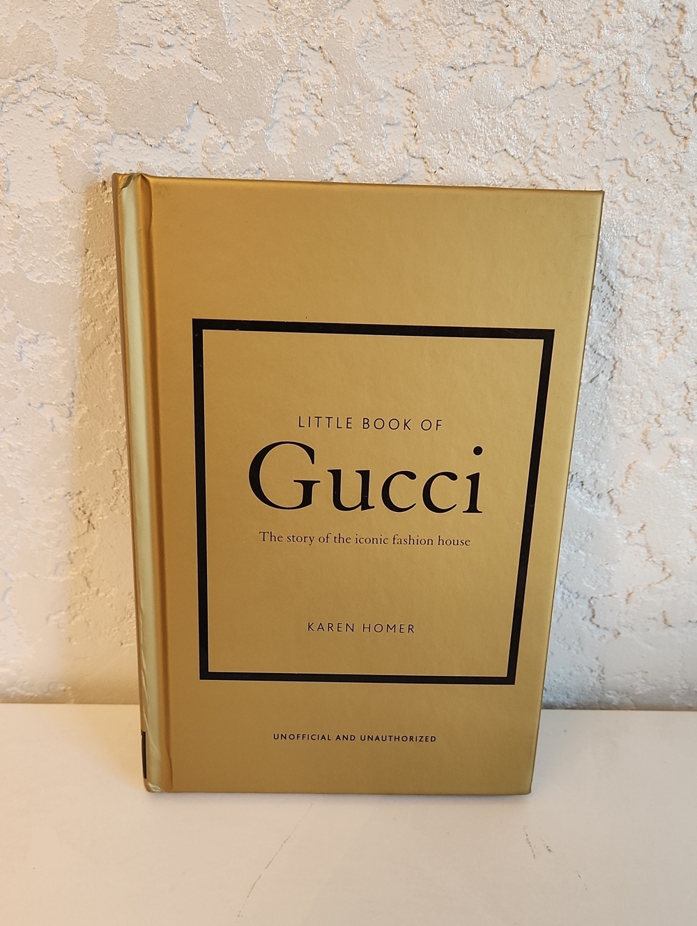 Gucci Gold Hardcover Book with Black Text